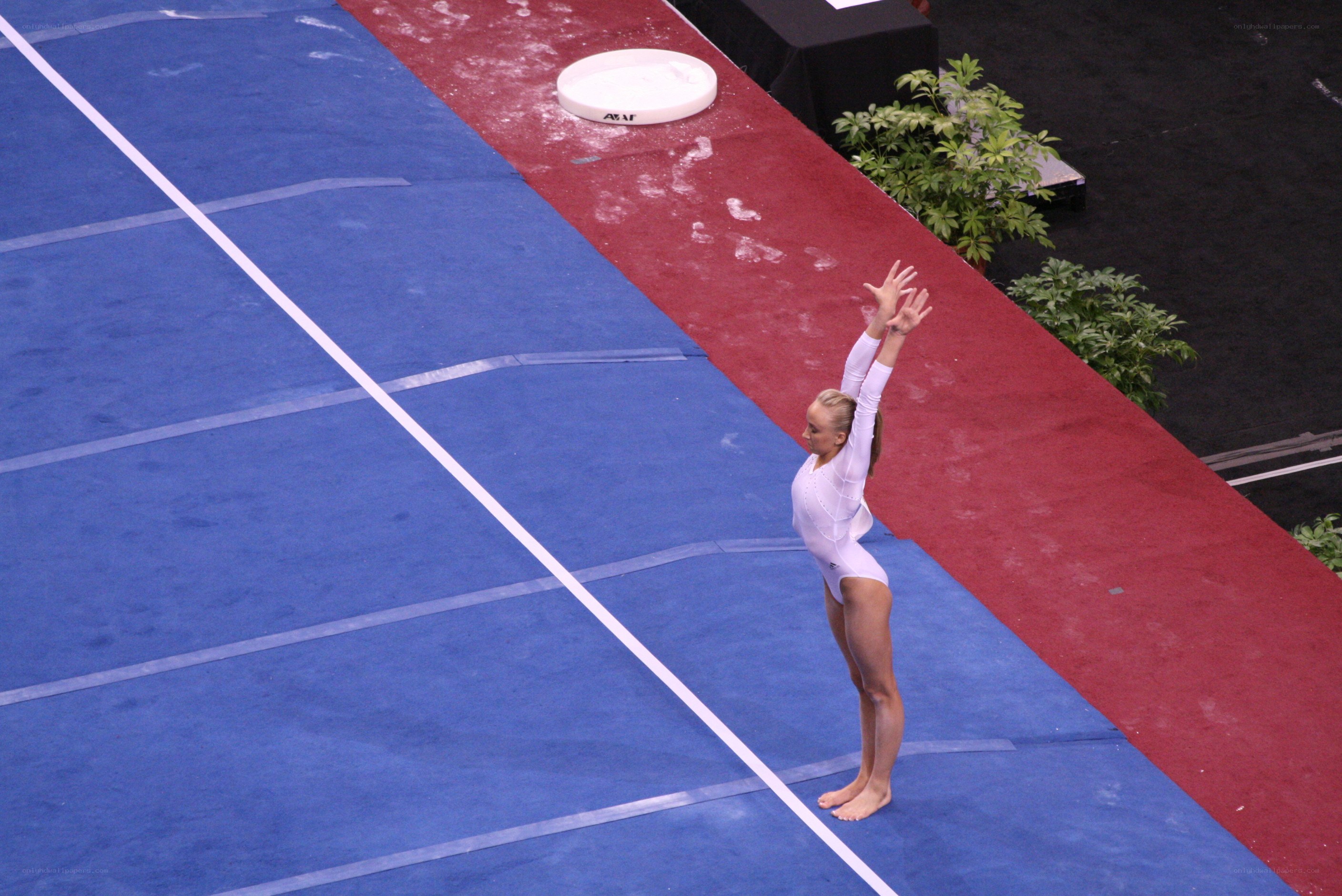 gymnast on blue mat