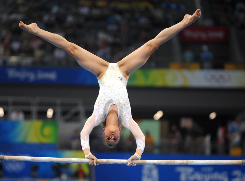 Gymnast on High Bar — White, Focused