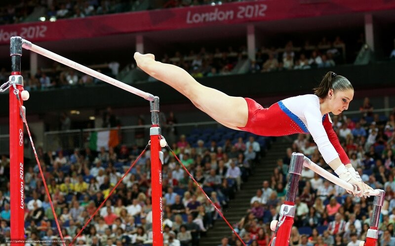 Gymnast on Uneven Bars — Red, Focused, Photograph