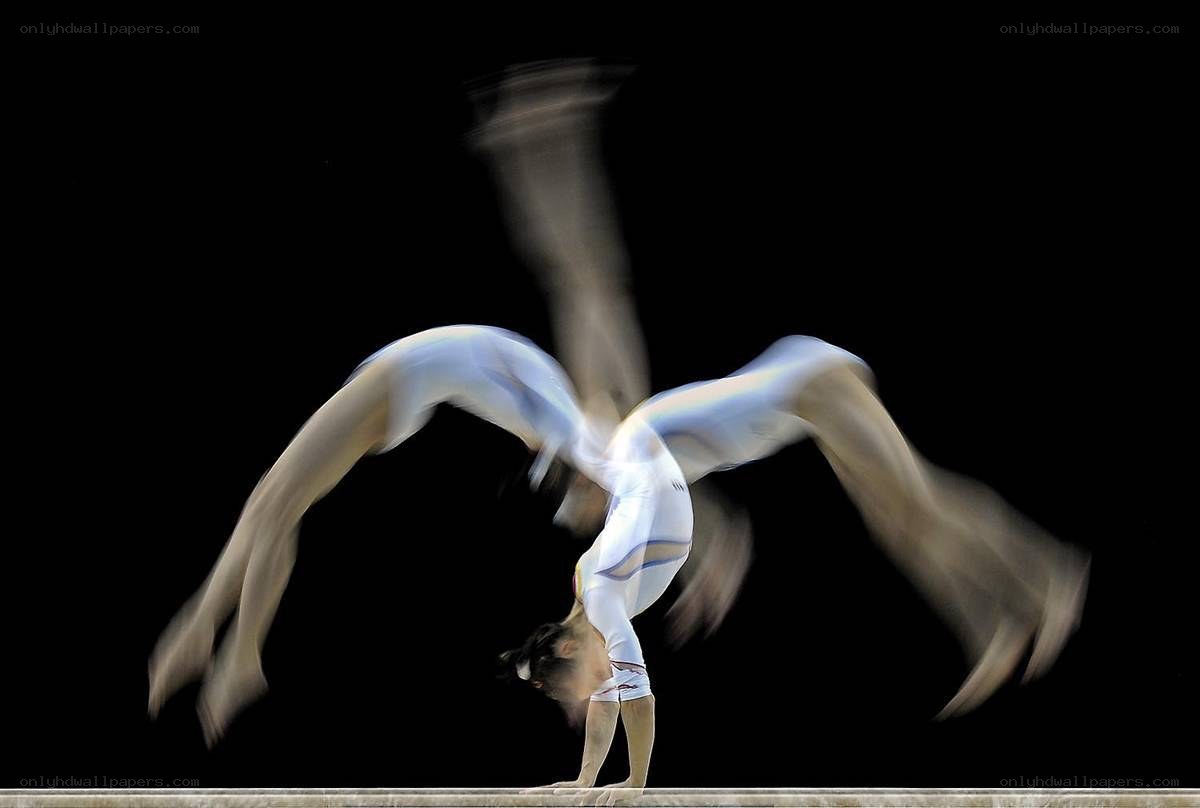 Gymnast performing on beam