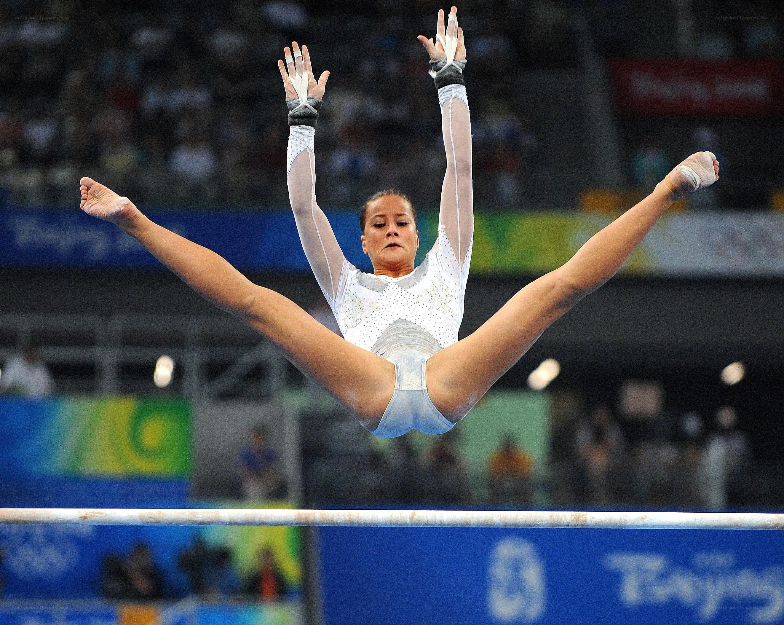 Gymnast performing on high bar