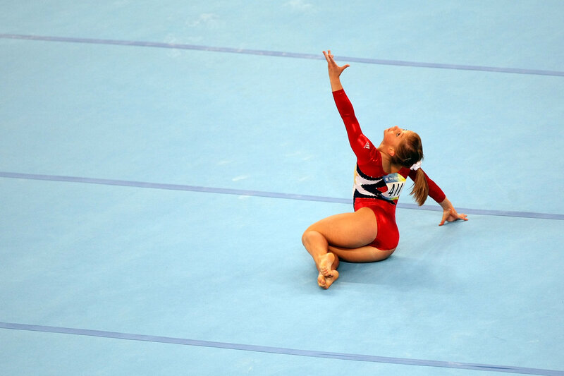 Gymnast Performing Routine — Red