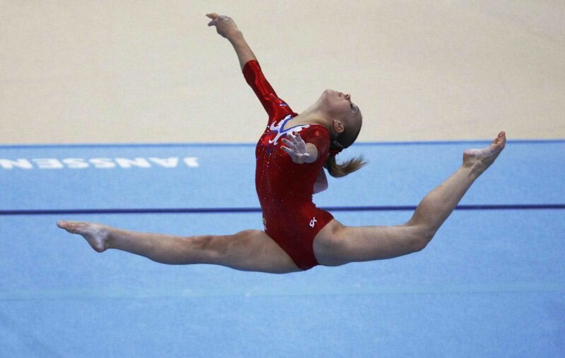 Gymnast Performing Split — Red