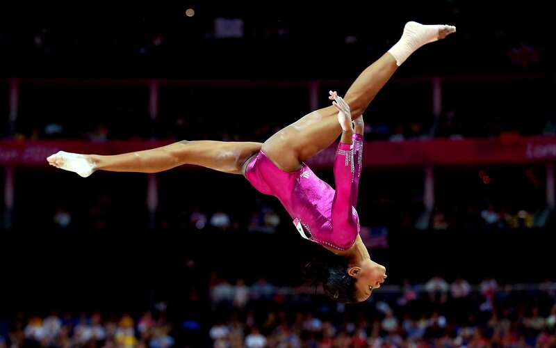 gymnast performing vault