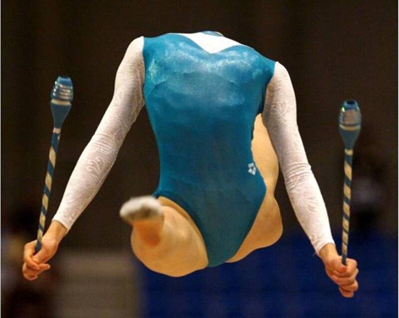 Gymnast Performing with Clubs