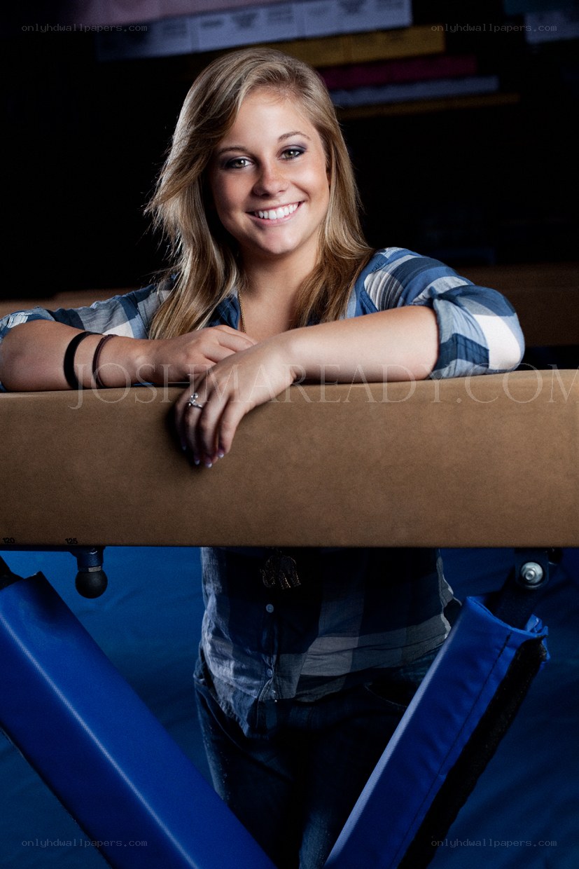 gymnast posing on beam