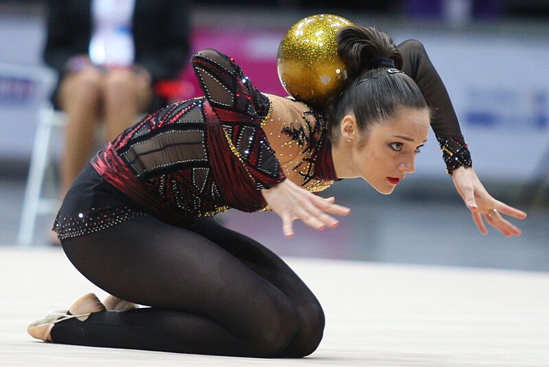 Gymnast with golden ball