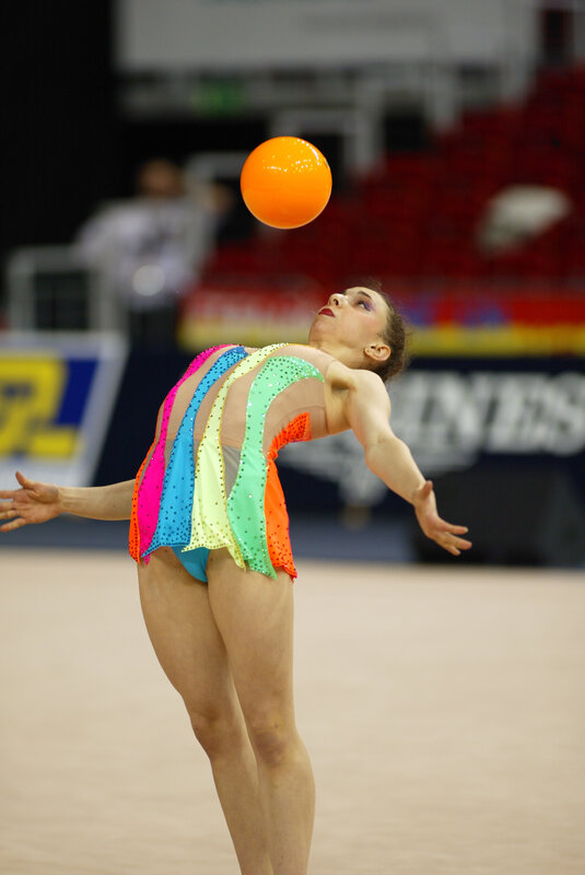 Gymnast with orange ball