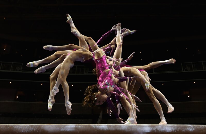 Gymnasts performing on beam