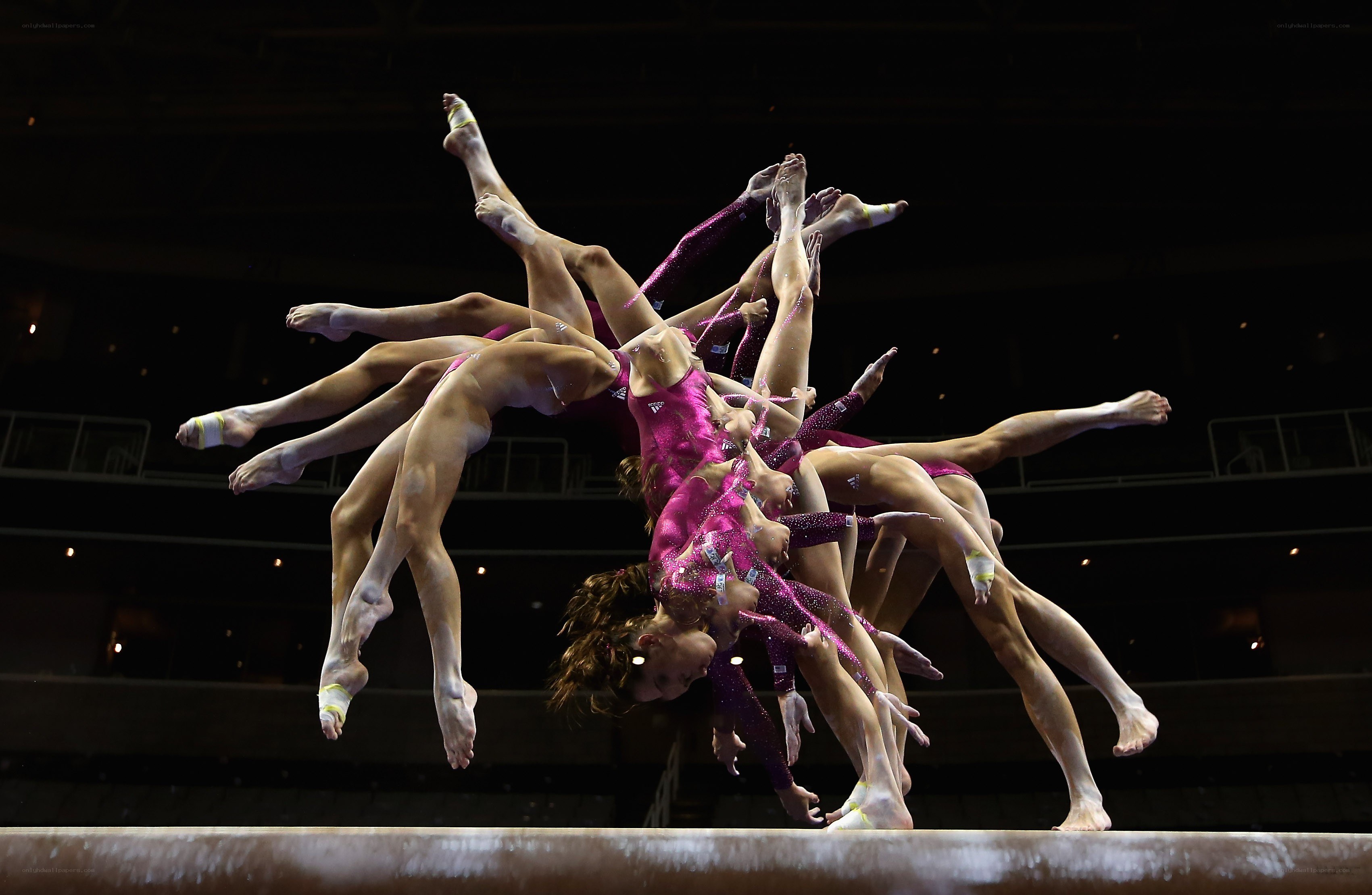 Gymnasts performing on beam
