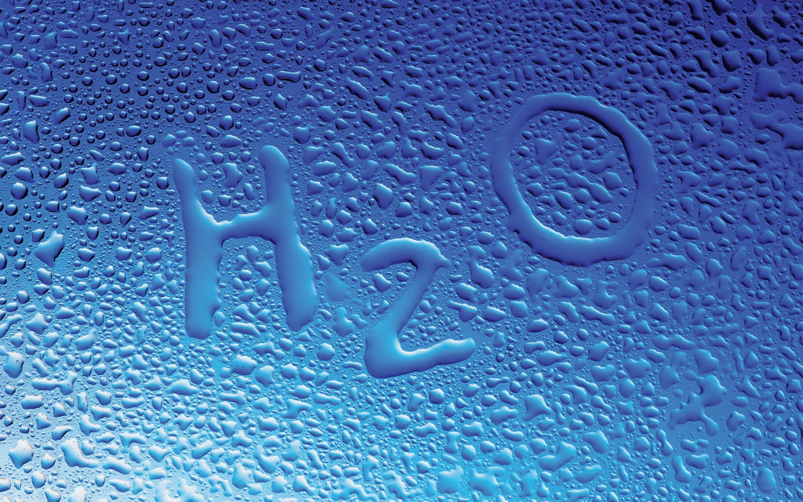 H2O written on a wet surface