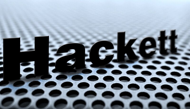Hackett text on perforated metal