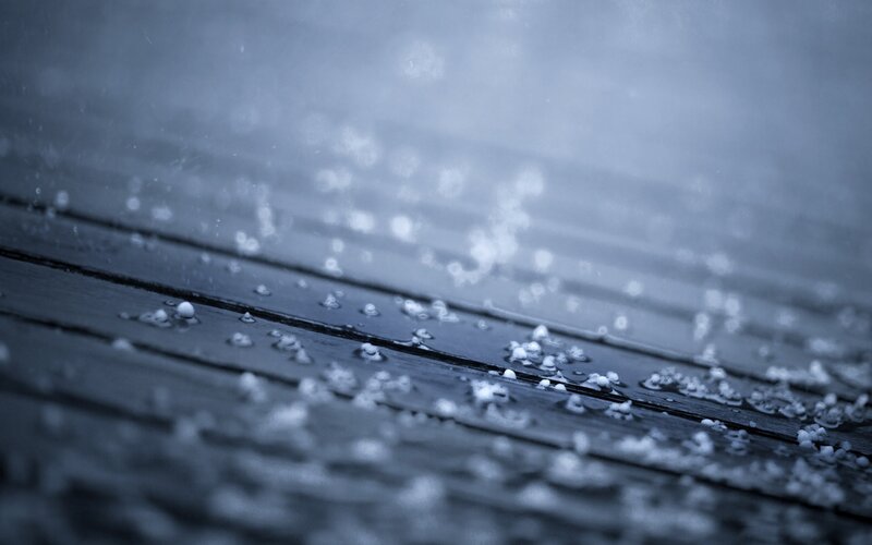 Hail on Wooden Surface