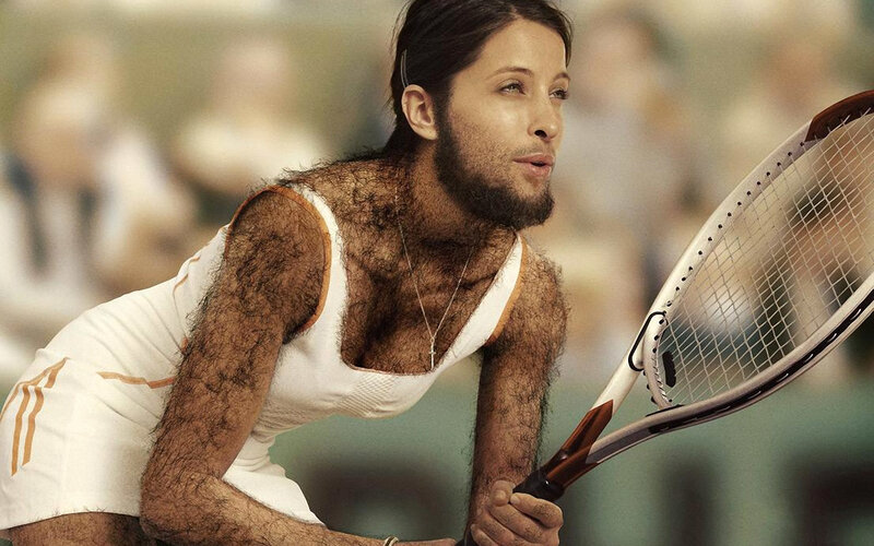 hairy tennis player in action