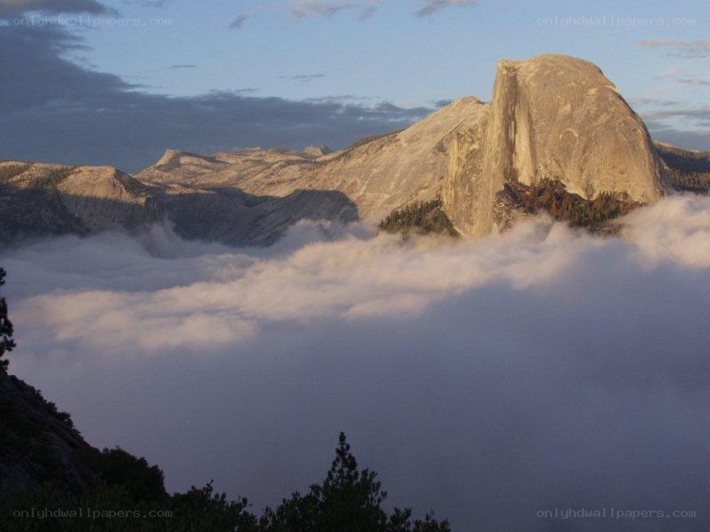 Half Dome at sunrise with clouds
