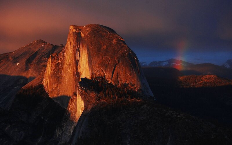 Half Dome at sunset with rainbow