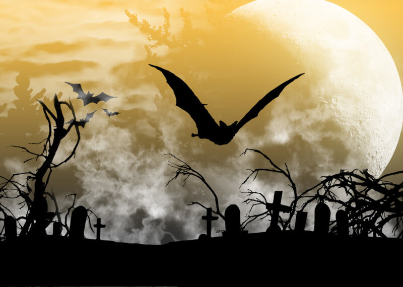 Halloween graveyard at night