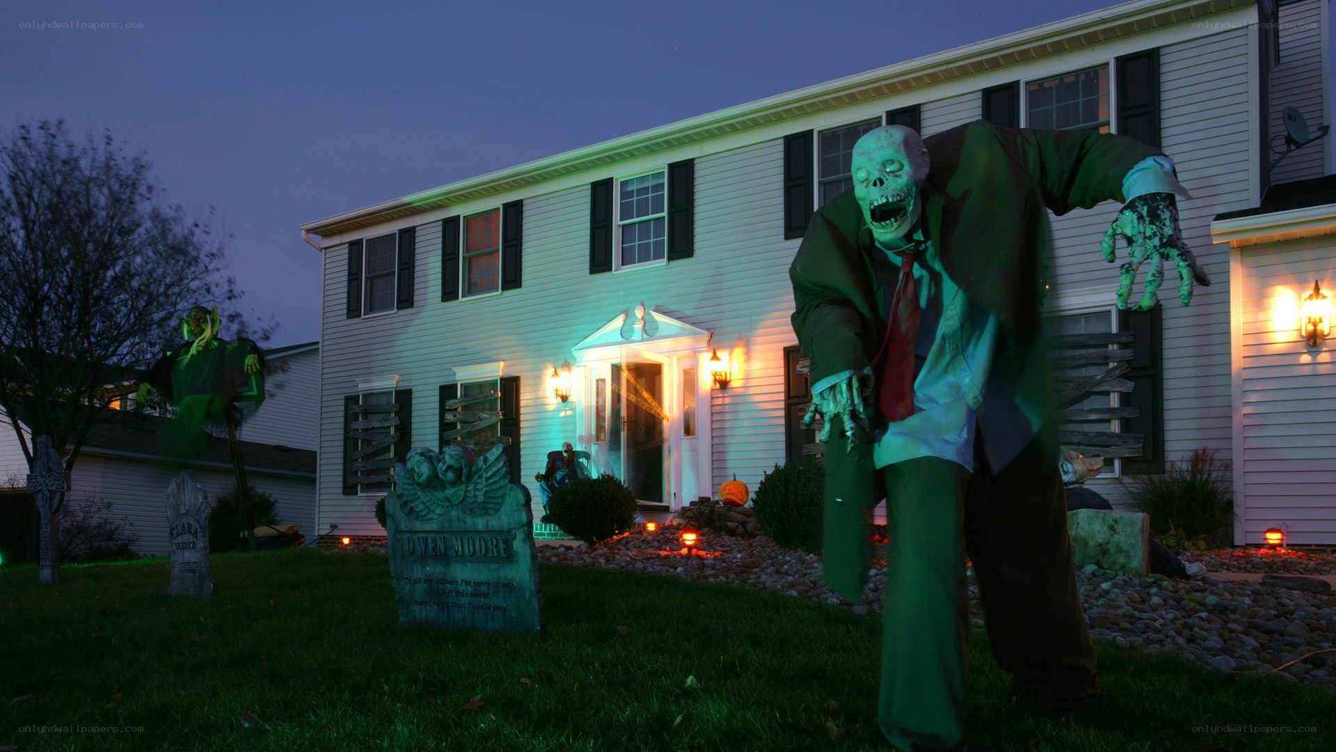 Halloween yard display with zombies