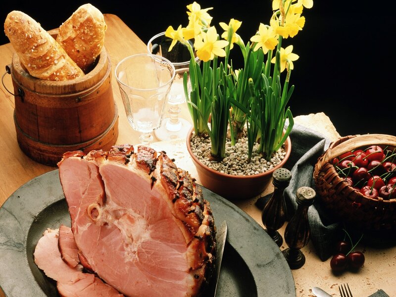 Ham and spring flowers on table