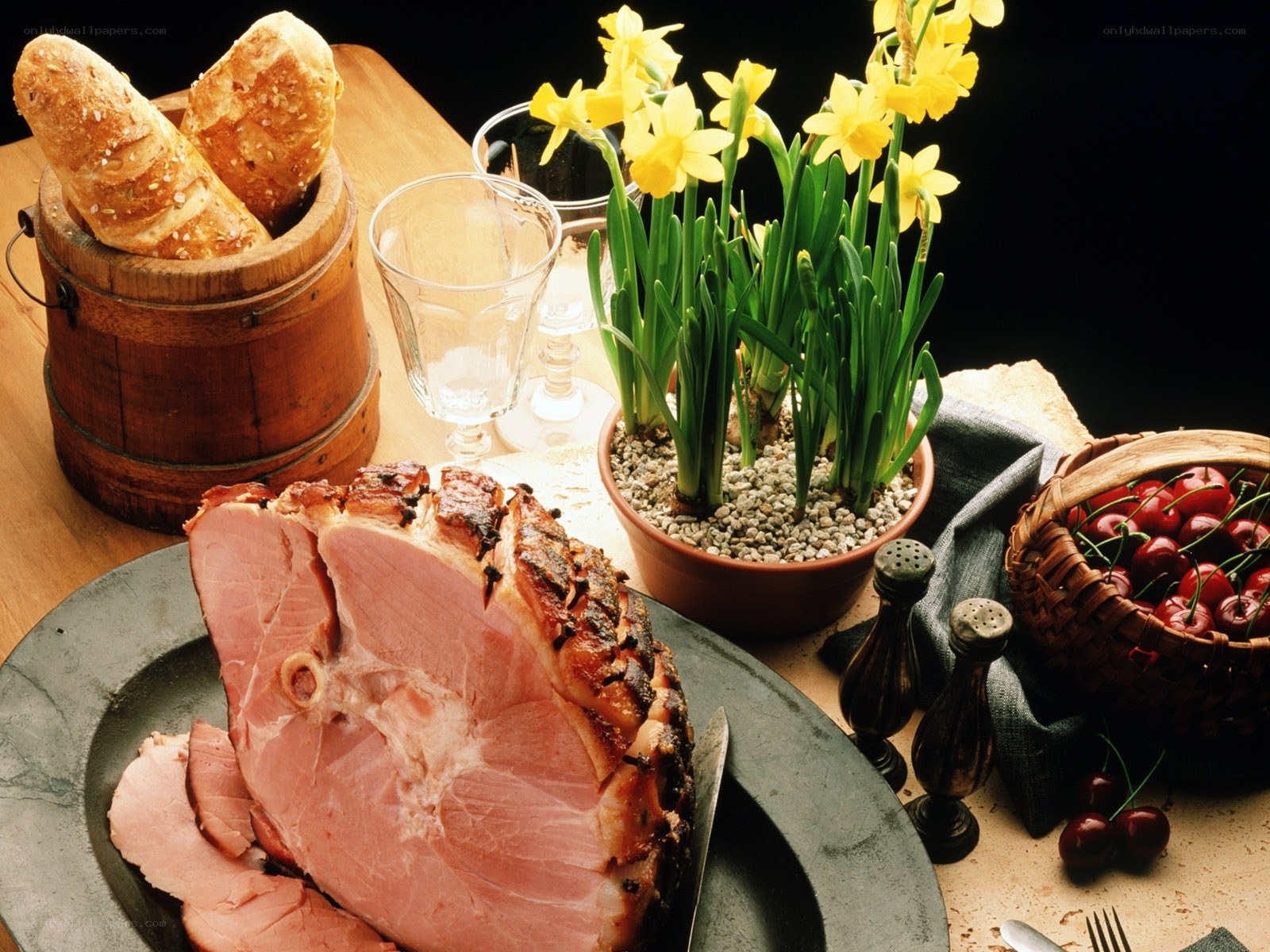 Ham and spring flowers on table