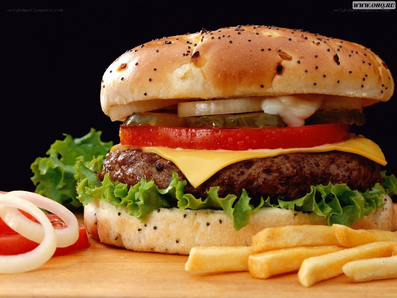 hamburger with fries and vegetables