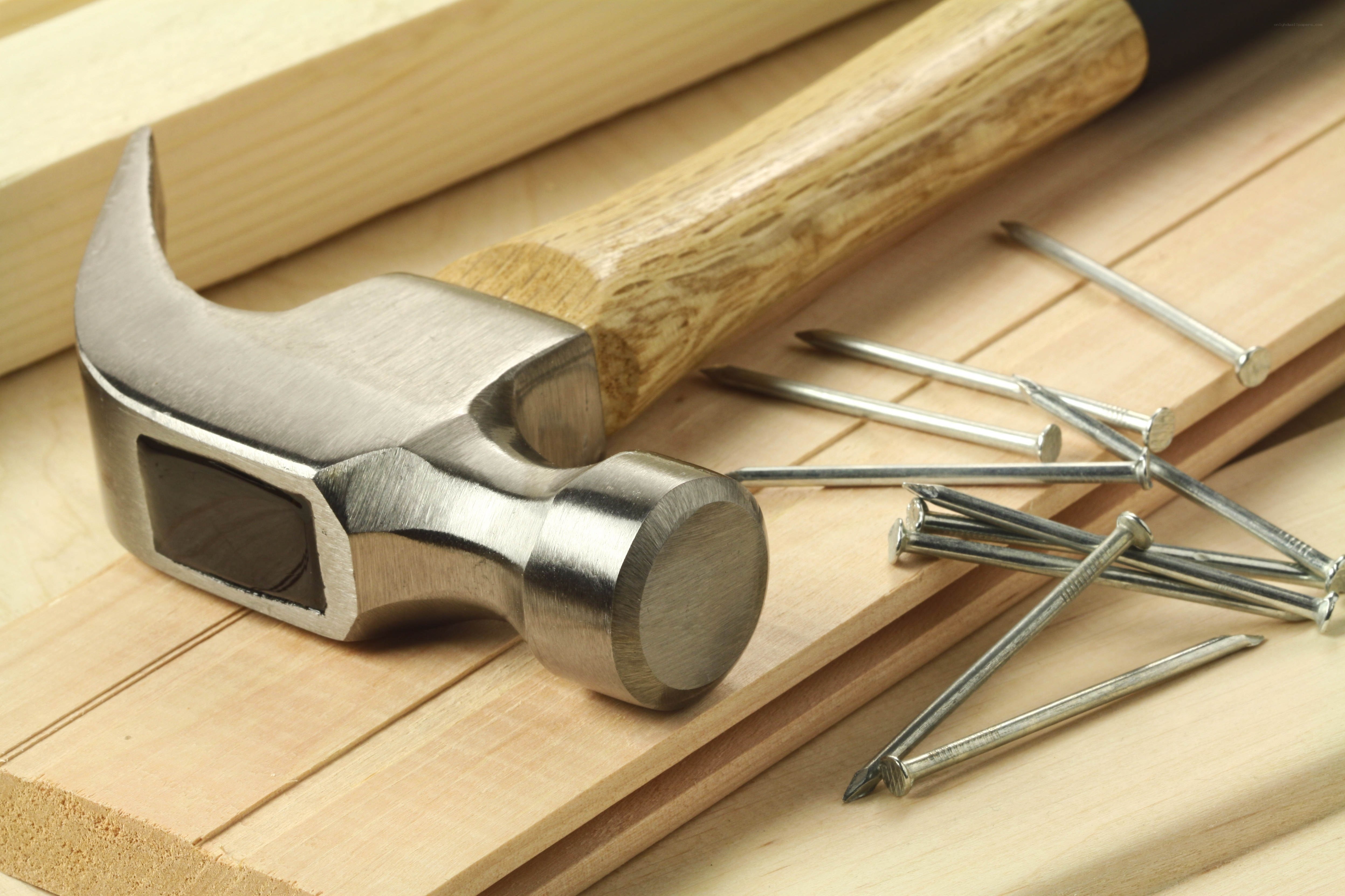 Hammer and nails on wood