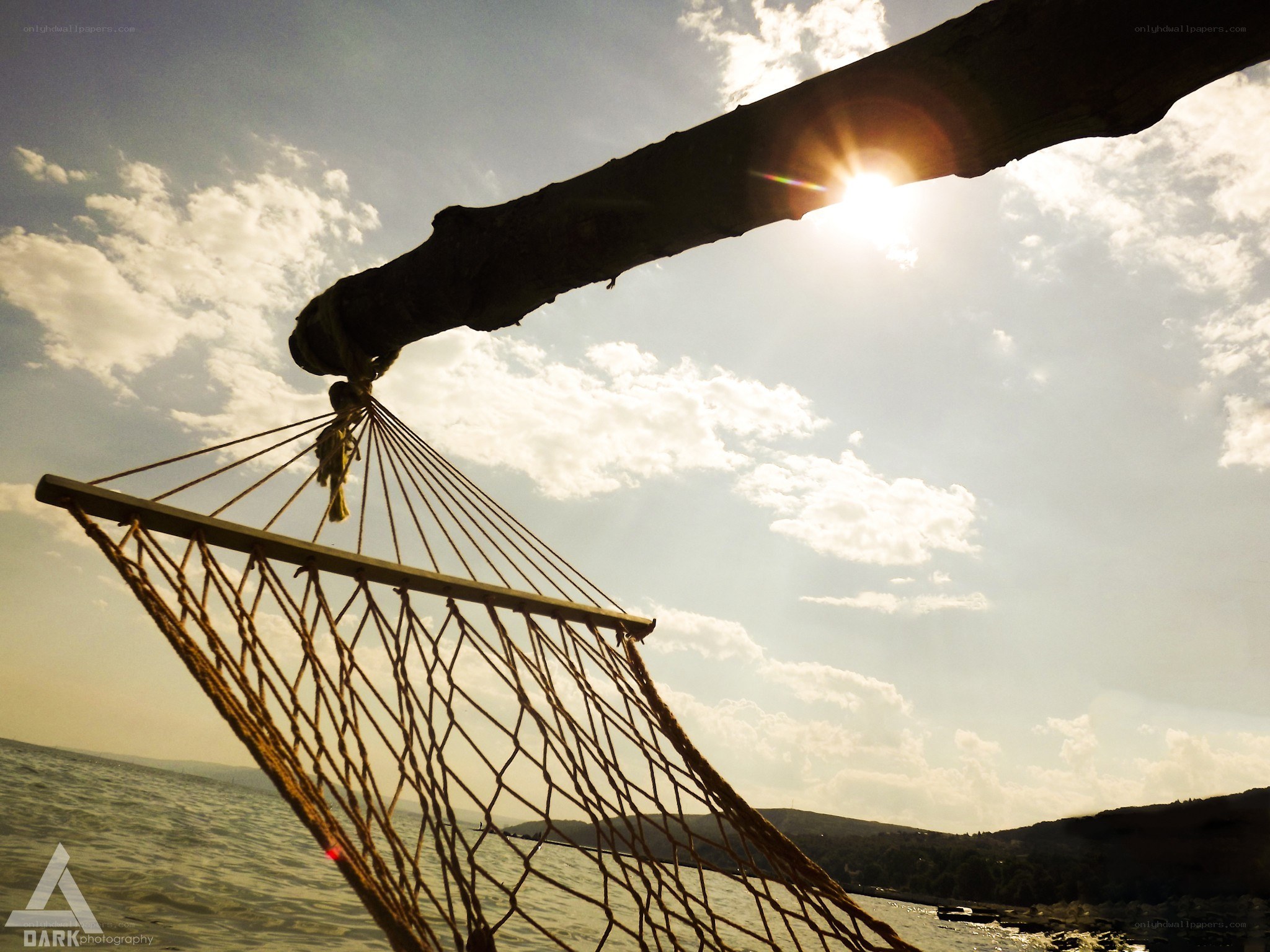 hammock by the sea at sunset