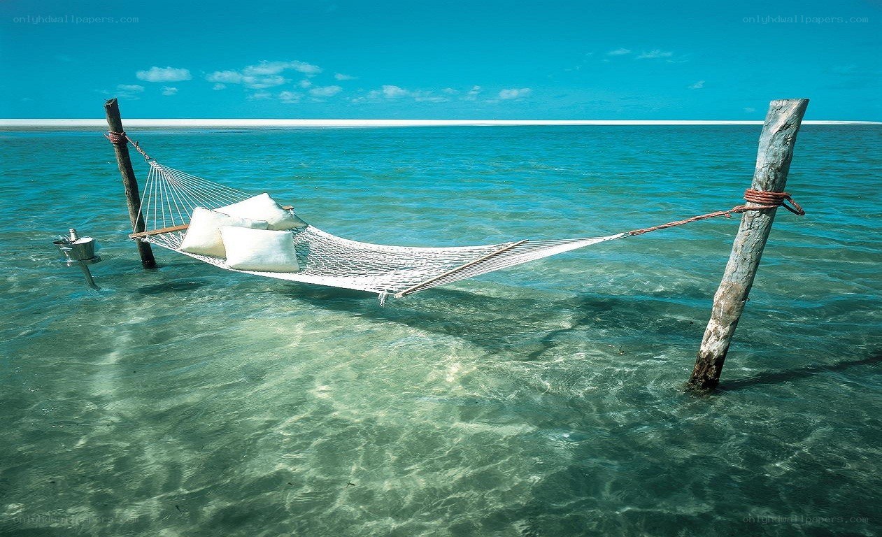 Hammock in clear ocean water