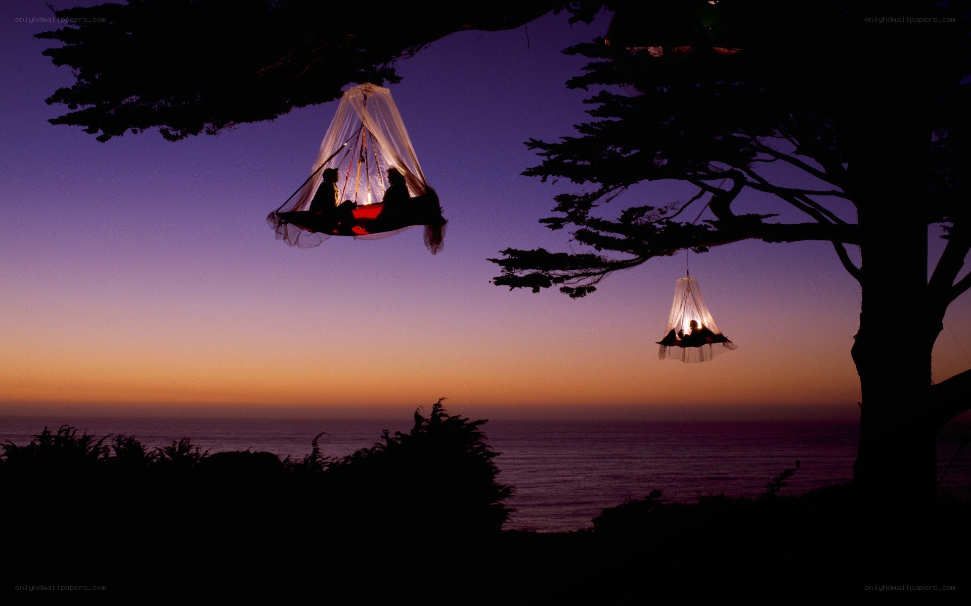 Hammocks at sunset by the sea