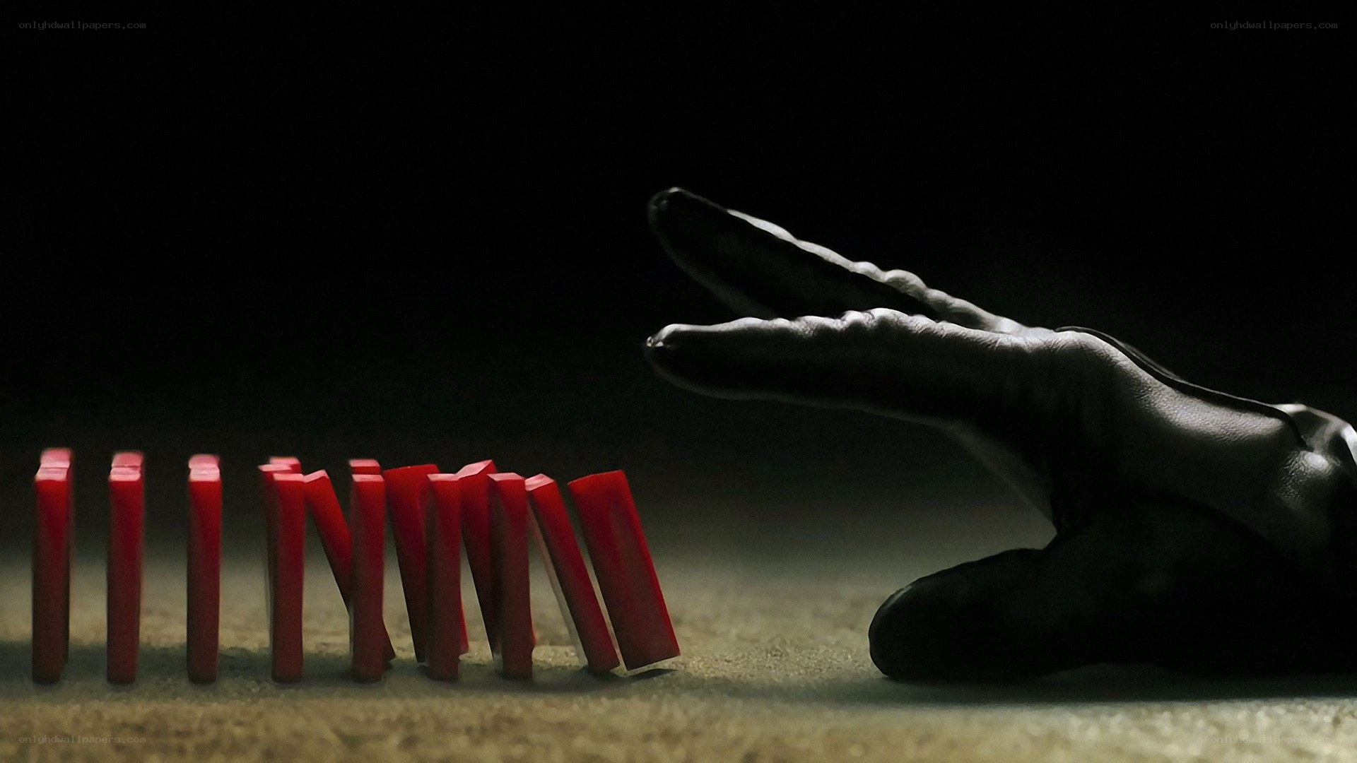Hand and red dominoes
