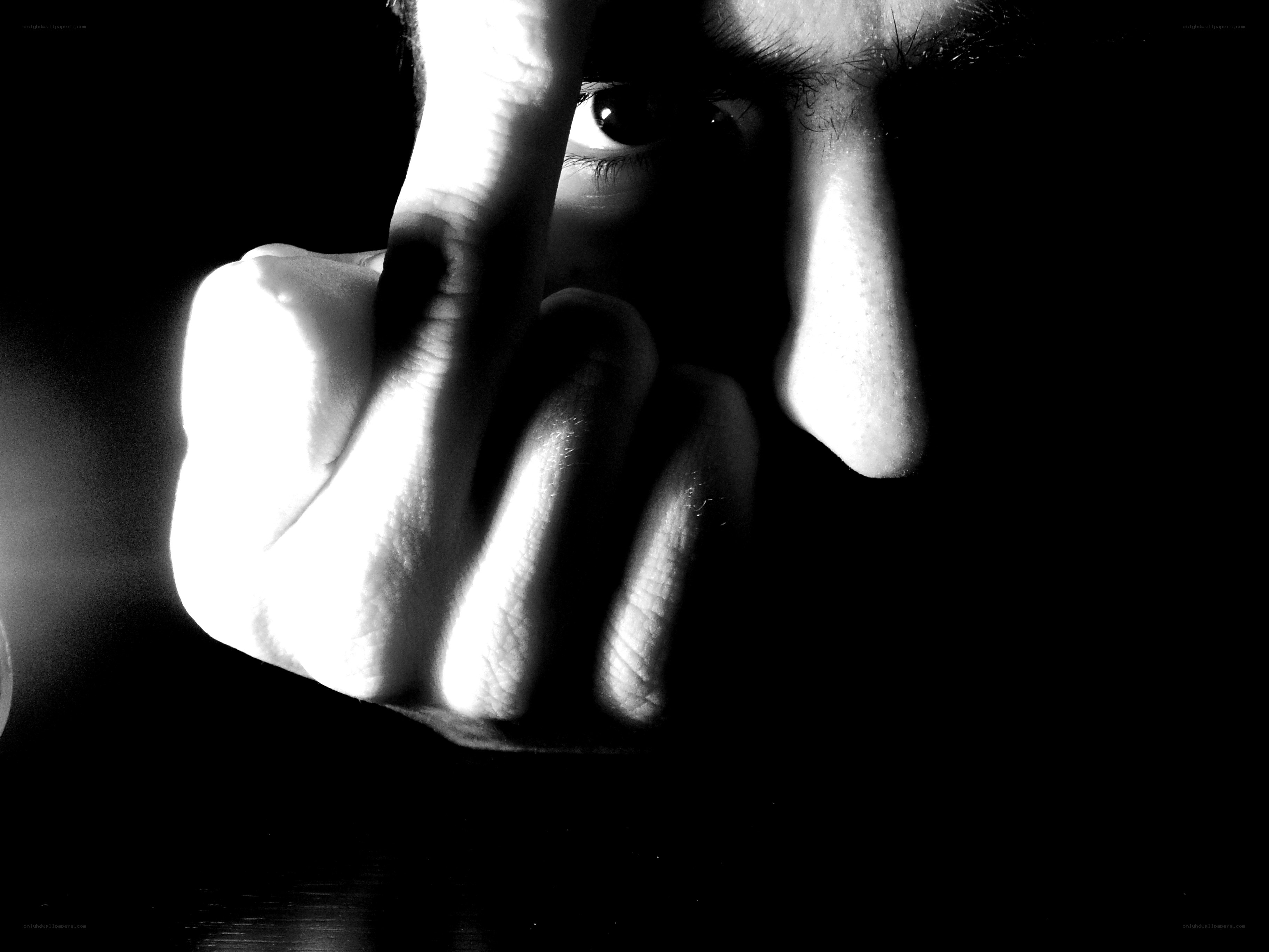 hand covering face in shadow