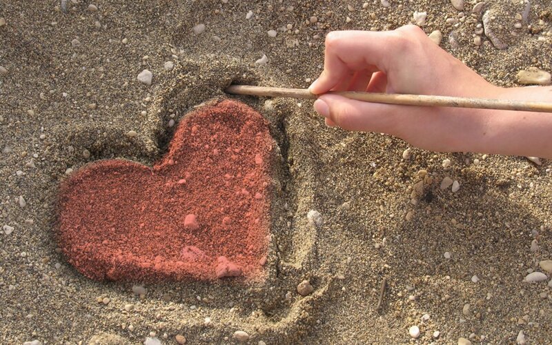 Hand Drawing Heart in Sand — Brown