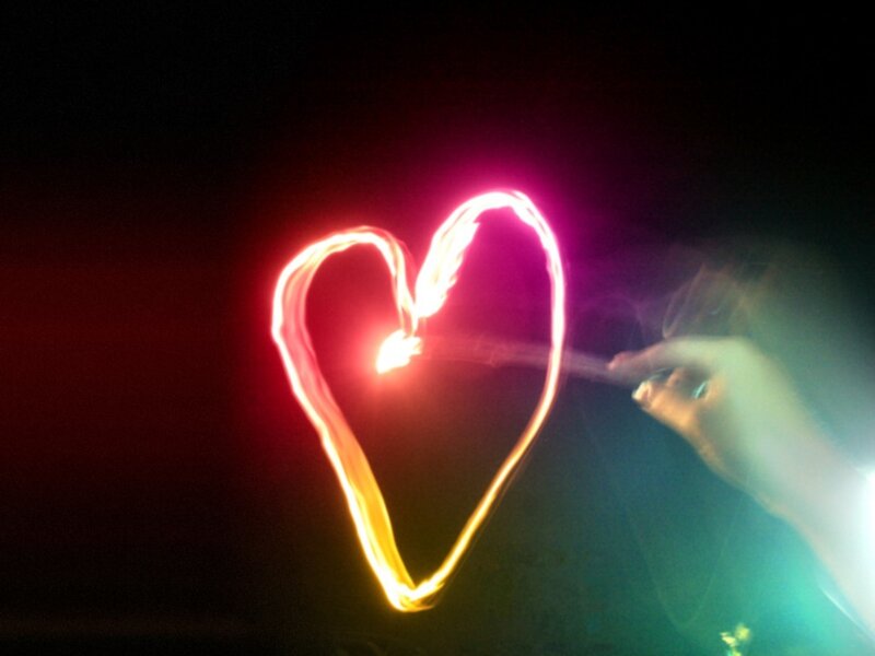 hand drawing heart with light