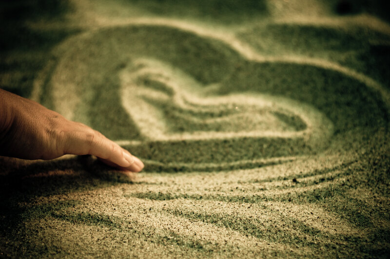 Hand Drawing in Sand — Brown