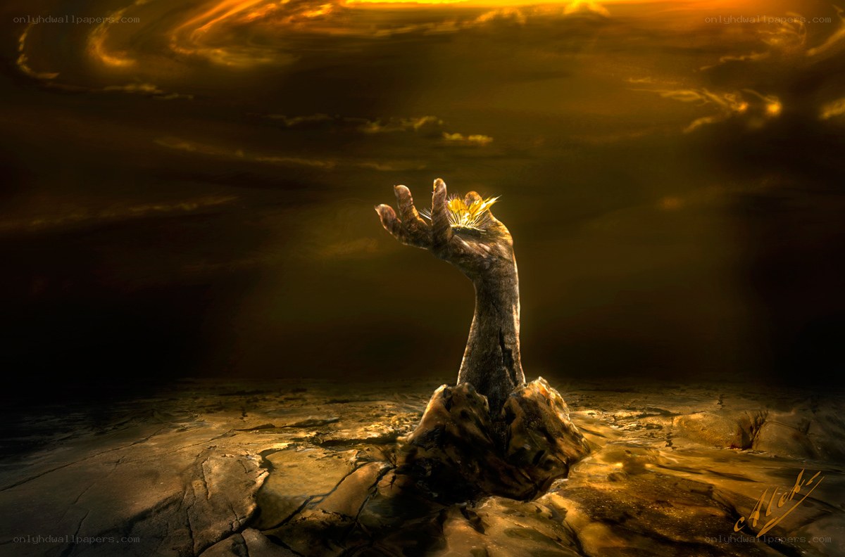 Hand emerging from cracked earth