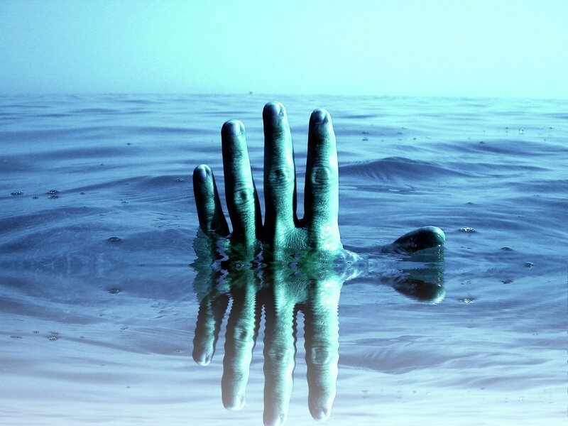 Hand emerging from water