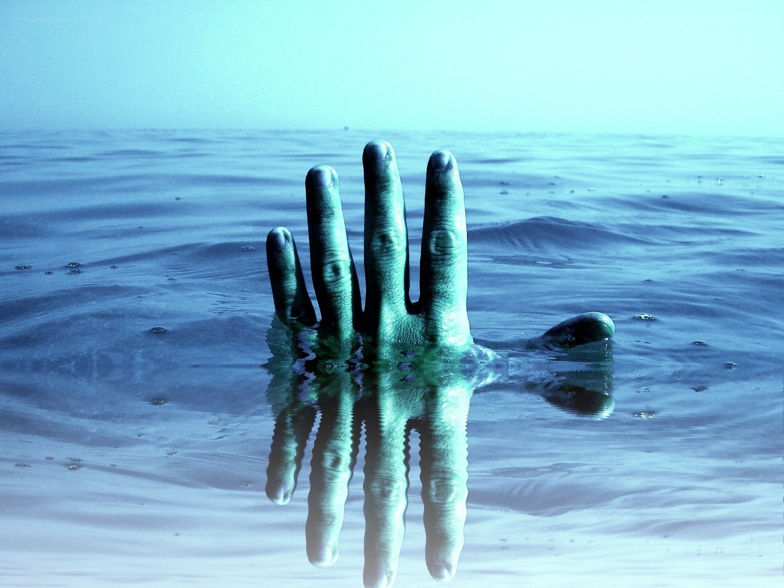 Hand emerging from water