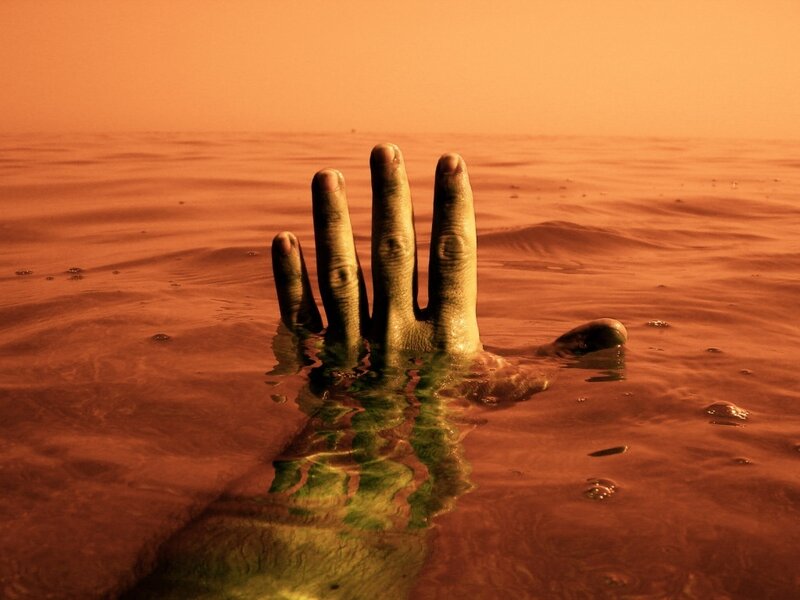 Hand emerging from water