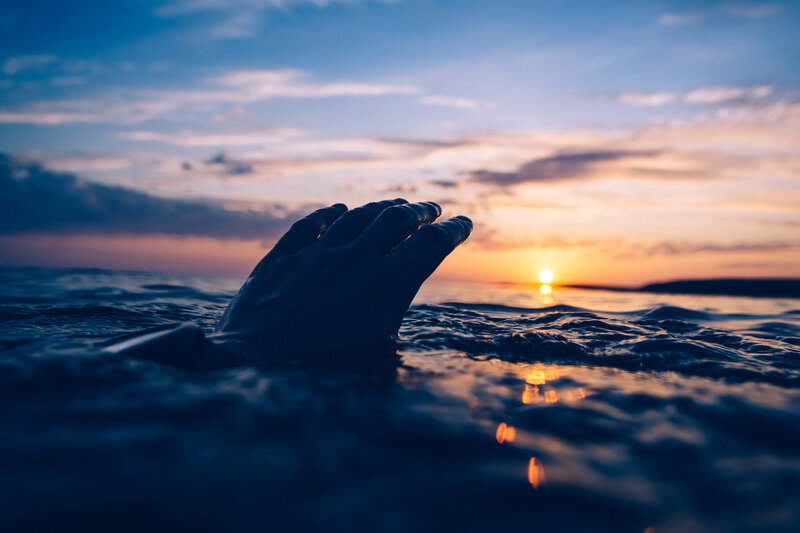 Hand Emerging from Water — Blue
