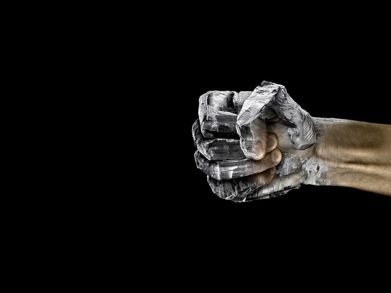 hand encased in stone
