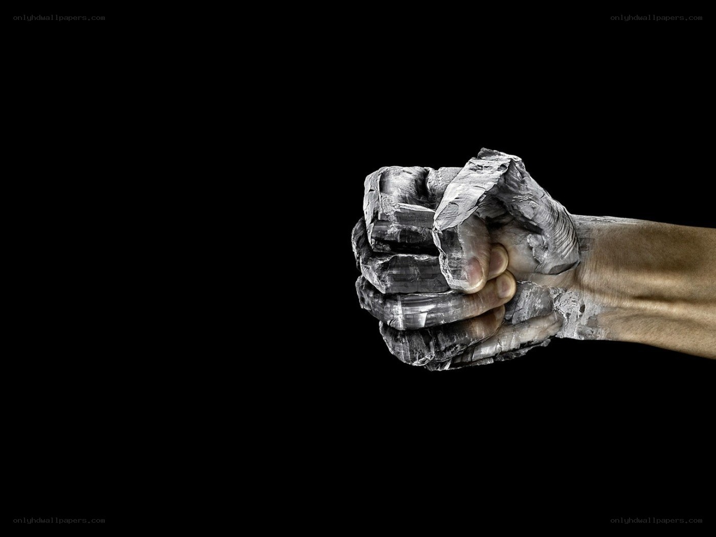 hand encased in stone