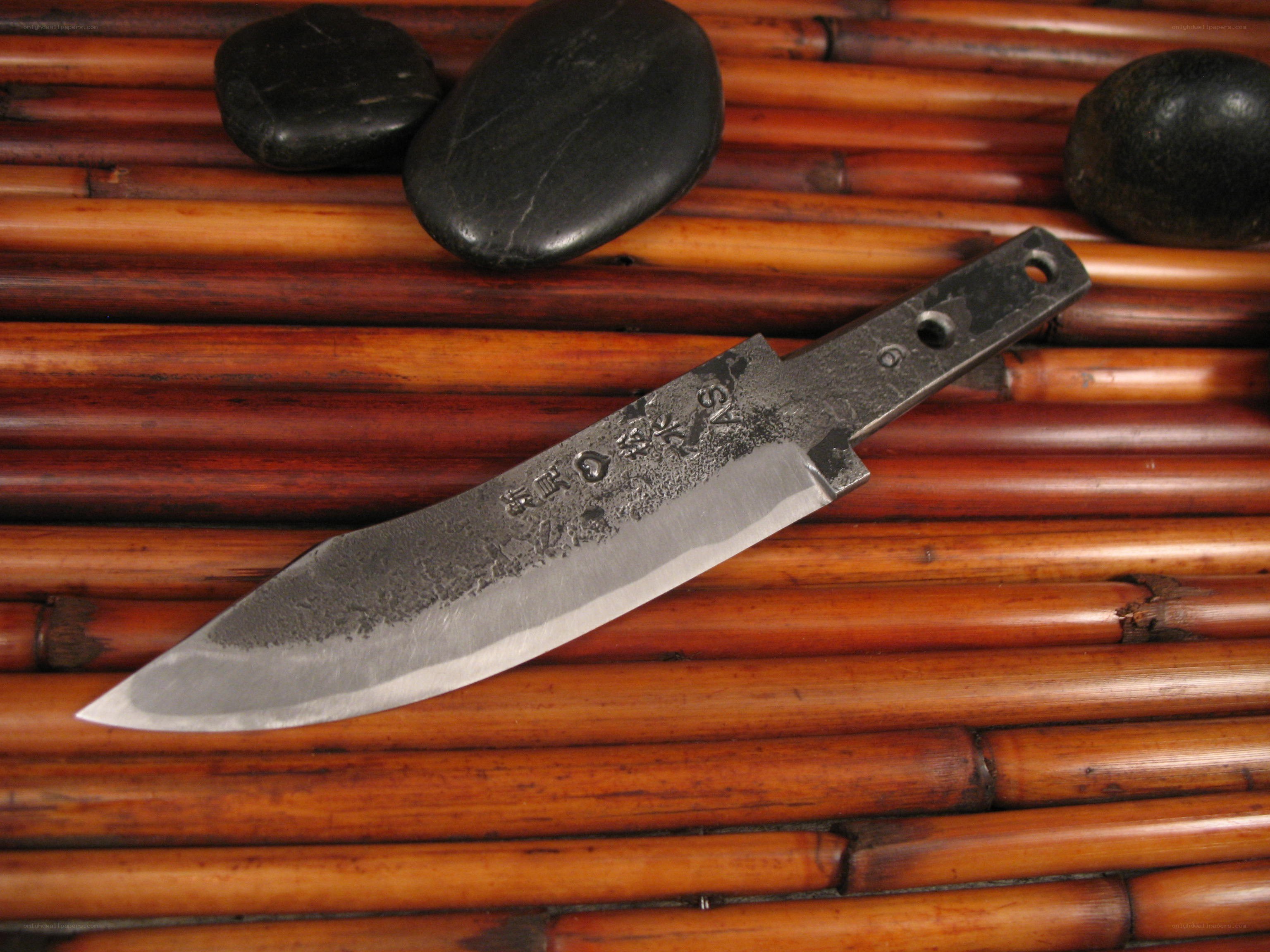Hand-forged knife on bamboo