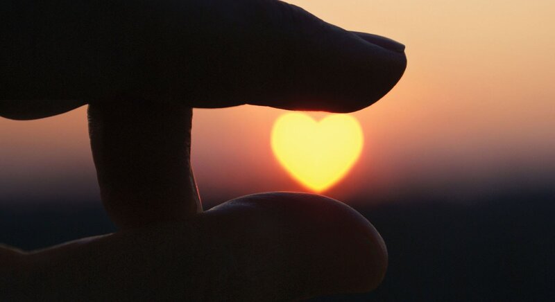 Hand Forming Heart Shape — Orange