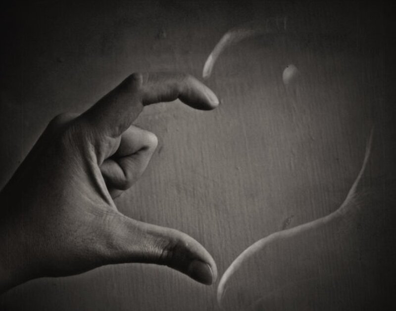 Hand forming heart shape