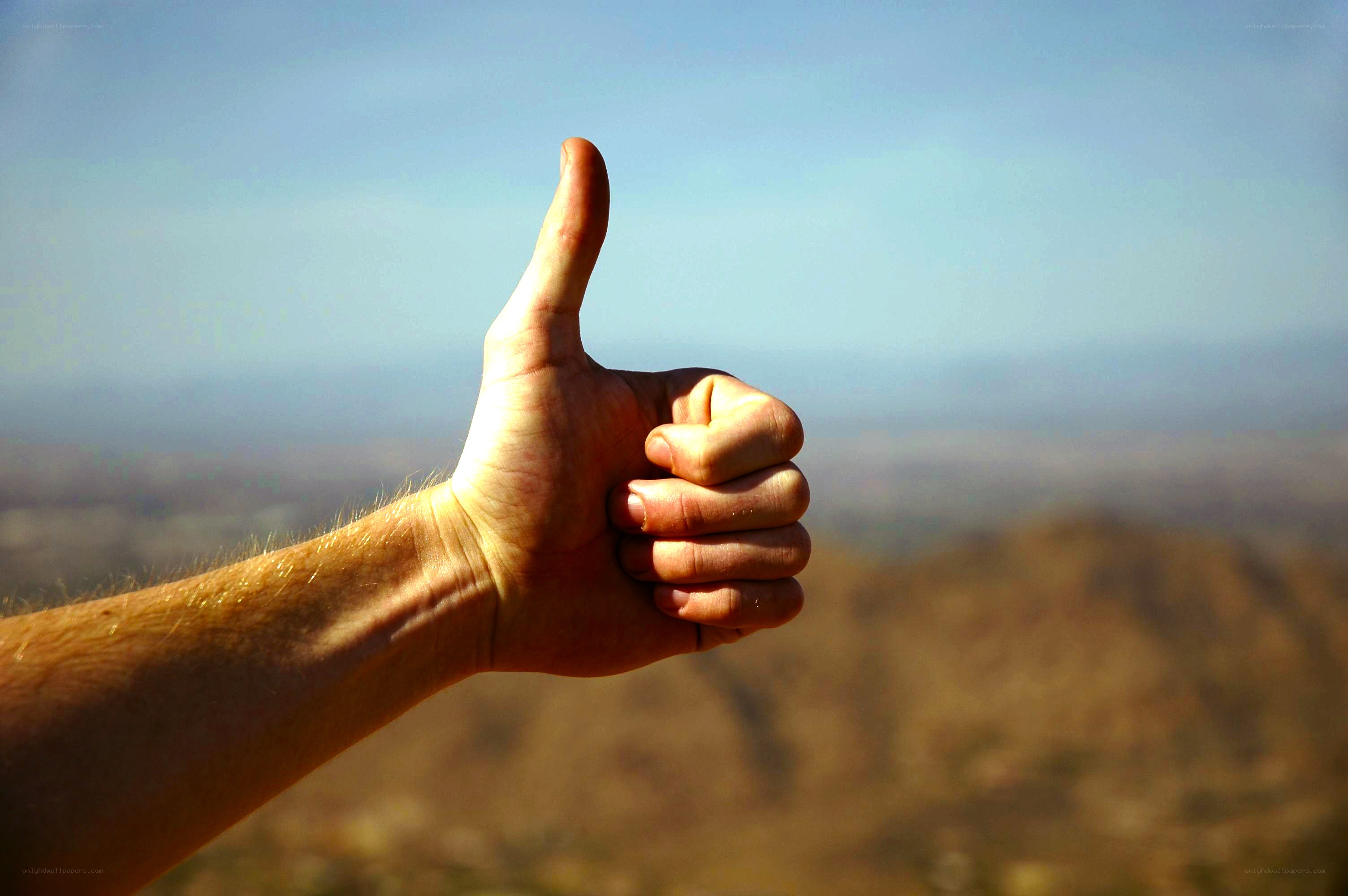 hand giving thumbs up gesture