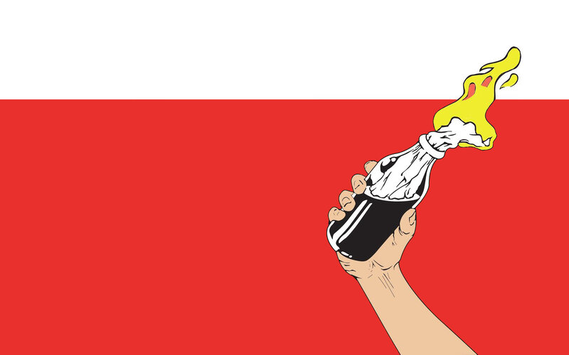 hand holding a bottle with flame