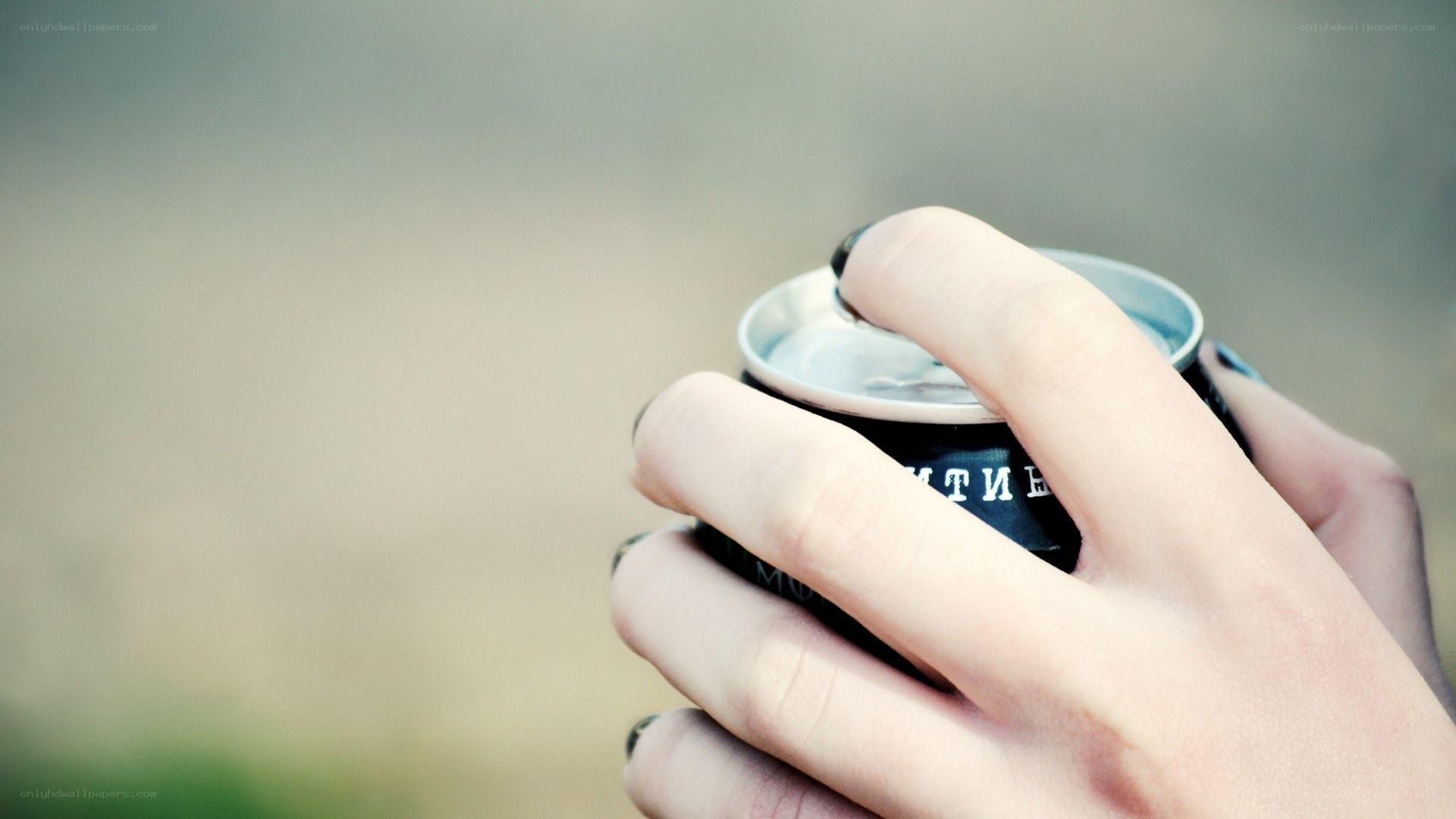 hand holding a can