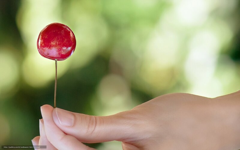 hand holding a cherry
