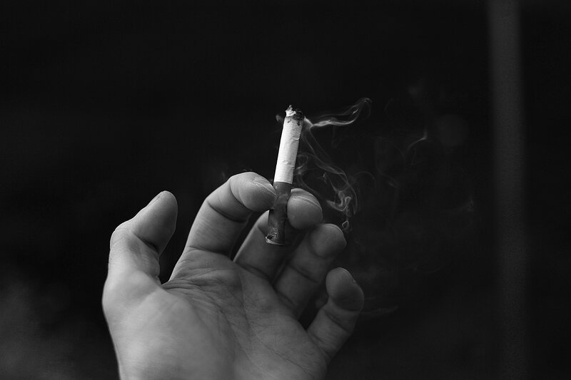 hand holding a cigarette