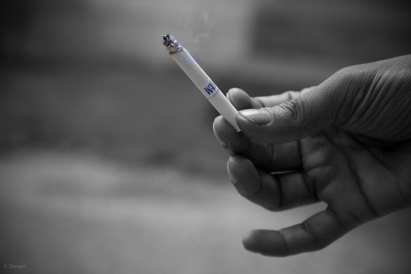 hand holding a cigarette